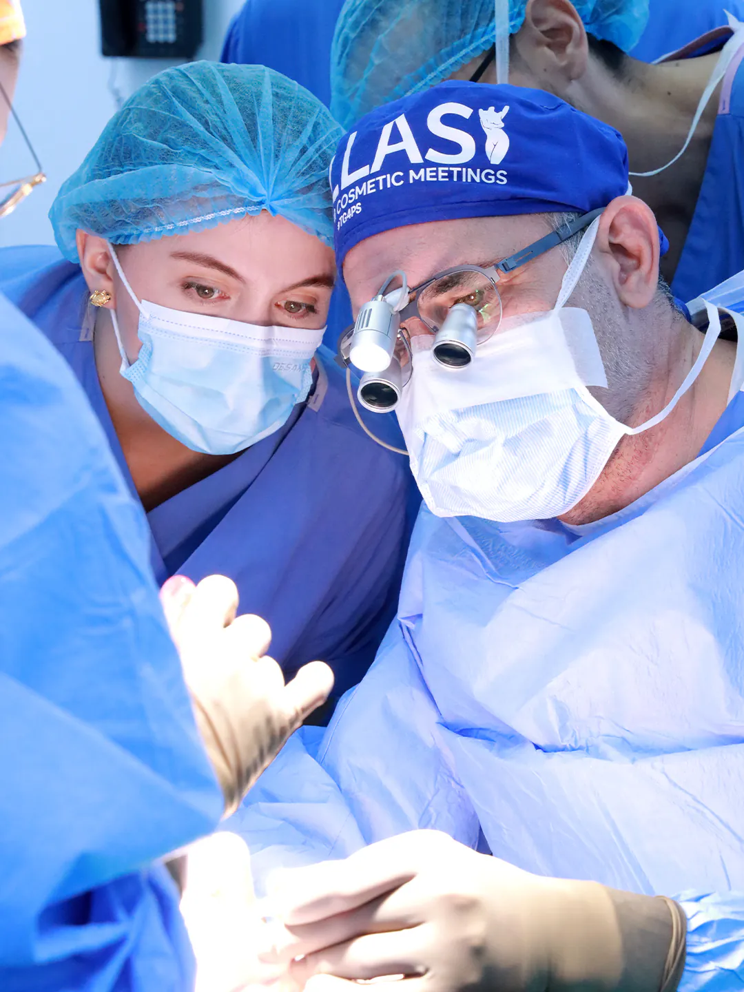 Close-up of Dr. Teoman Dogan and an assistant surgeon during an operation
